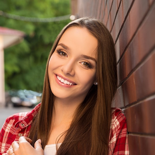 Woman smiling at Weston Orthodontic Associates in Weston, MA